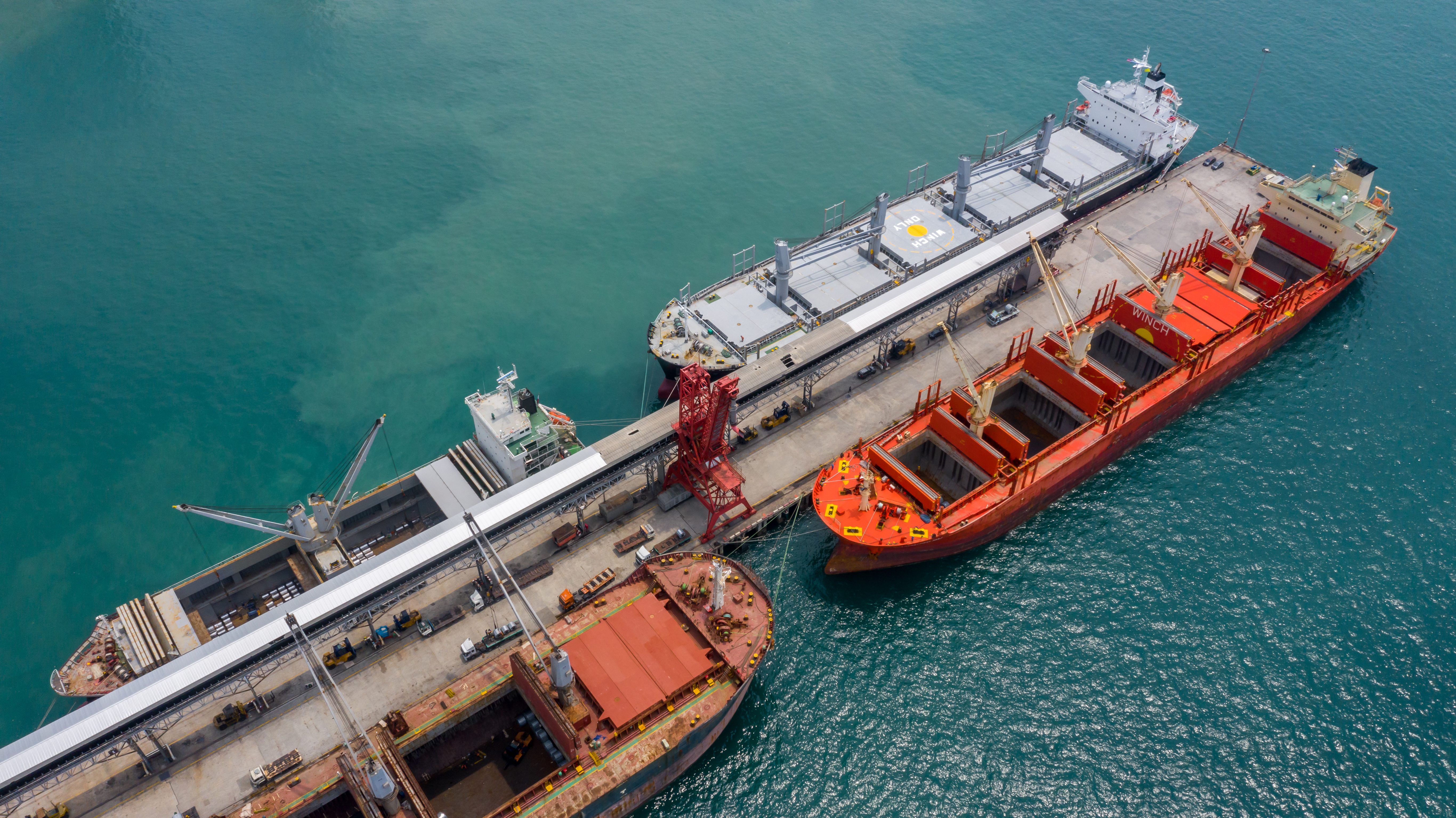 Top view of large general cargo ship and bulk carrier.