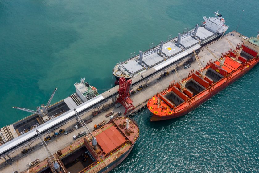 Top view of large general cargo ship and bulk carrier.